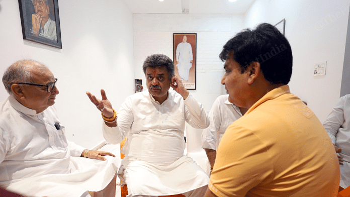 Congress candidate Chander Mohan (middle) during a break from his campaign in Haryana's Panchkula constituency | Manisha Mondal | ThePrint