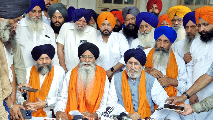 SGPC president Harjinder Singh Dhami (seated, centre) addresses a press conference after being re-elected for a fourth consecutive term, in Amritsar on Monday | ANI