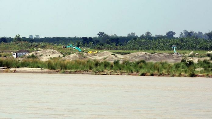 Payloaders and earth-moving machines on the Yamuna banks of village | Suraj Singh Bisht | ThePrint