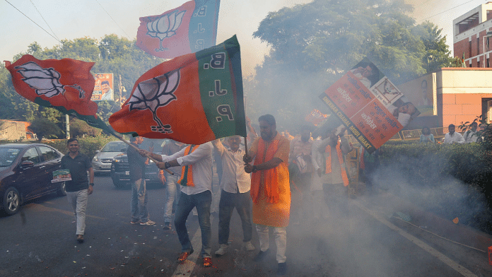 Jubilant BJP workers celebrate their party's third consecutive win in Haryana outside the BJP national headquarters in New Delhi on Tuesday | Suraj Singh Bisht | ThePrint