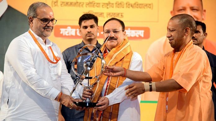 (Right to left) Uttar Pradesh Chief Minister Yogi Adityanath, Bharatiya Janata Party (BJP) National President JP Nadda and party state chief Bhupendra Singh Chaudhary during the state working committee meeting in Lucknow on Sunday. | ANI