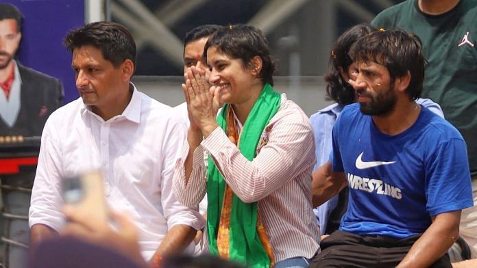 File photo of Vinesh Phogat (Centre) with Congress leader Deepender Hooda (L) and fellow wrestler Bajrang Punia (R) | Suraj Singh Bisht | ThePrint