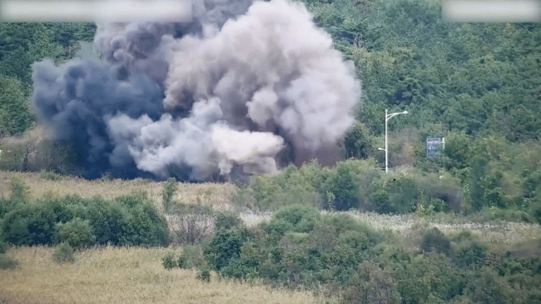 North Korea blows up parts of inter-Korean road on its side of border as tensions soar