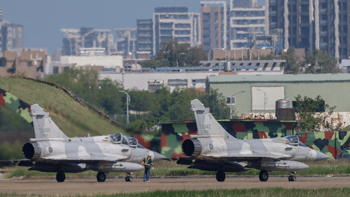 Taiwan Air Force Mirage 2000 aircraft prepare to takeoff at Hsinchu Air Base in Hsinchu, Taiwan October 14, 2024. REUTERS/Tyrone Siu