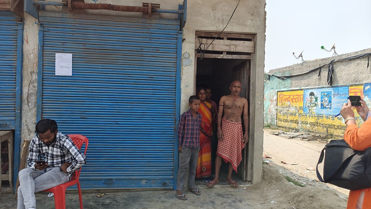 Moon Jaiswal, resident of Mahsi’s Maharajganj block in Bahraich, with his family. They have been served an anti-encroachment notice | Mayank Kumar | ThePrint