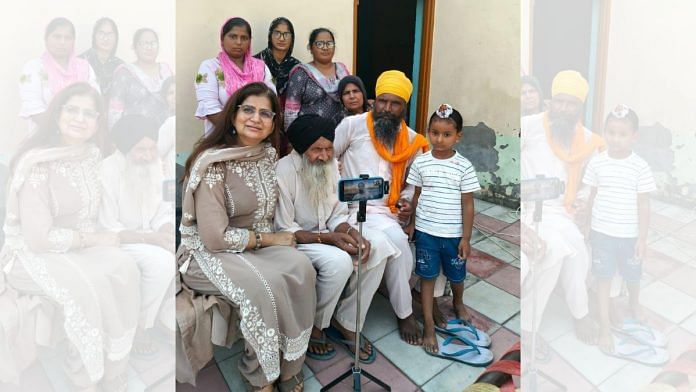 Mahinder Singh Gill, his family and historian Nonica Datta in Bandala on Zoom call with his separated family in Nankana Sahib, Pakistan. | Photo by Harjit Singh Gill