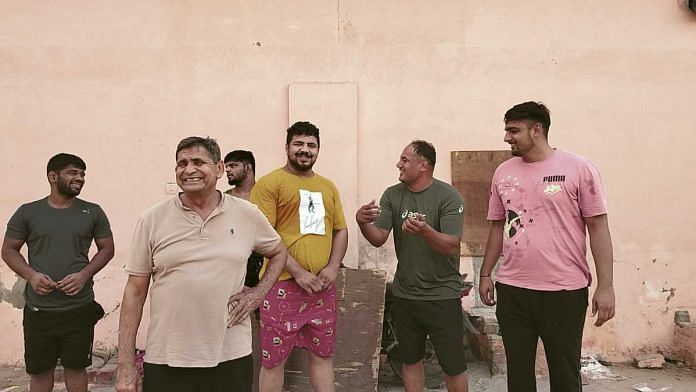 Former wrestler Ranbir Dhaka turned coach after a ligament tear cut his career short. He’s been coaching at Mehar Singh akhada since 2005. | Shubhangi Misra | ThePrint