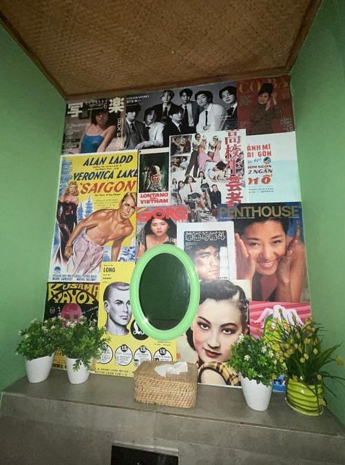 The restroom at Ping's Bia Hoi is decorated with film posters and magazine covers. | By special arrangement 