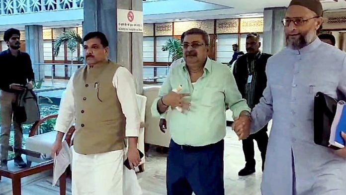 TMC MP Kalyan Banerjee with AIMIM MP Asaduddin Owaisi and AAP MP Sanjay Singh after he hurt himself during the heated exchange with BJP MP Abhijit Gangopadhyay at the JPC meeting on Waqf Bill | ANI