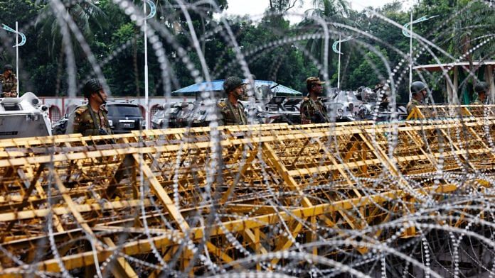 Security personnel stand guard in front of the Bangabhaban in Dhaka | Photo: REUTERS/Mohammad Ponir Hossain