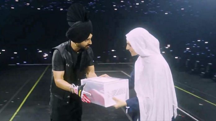 Diljit Dosanjh gifting a pair of shoes to a Pakistani fan, 29 September