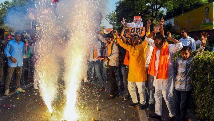 Bharatiya Janata Party (BJP) supporters celebrate the party's lead in early trends during the counting of votes for the Haryana Assembly elections, at party headquarters in New Delhi, Tuesday. | ANI