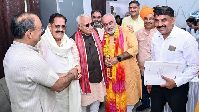 BJP candidate Jagmohan Anand, accompanied by Manohar Lal Khattar, filing his nomination papers from Karnal on 11 September | ANI