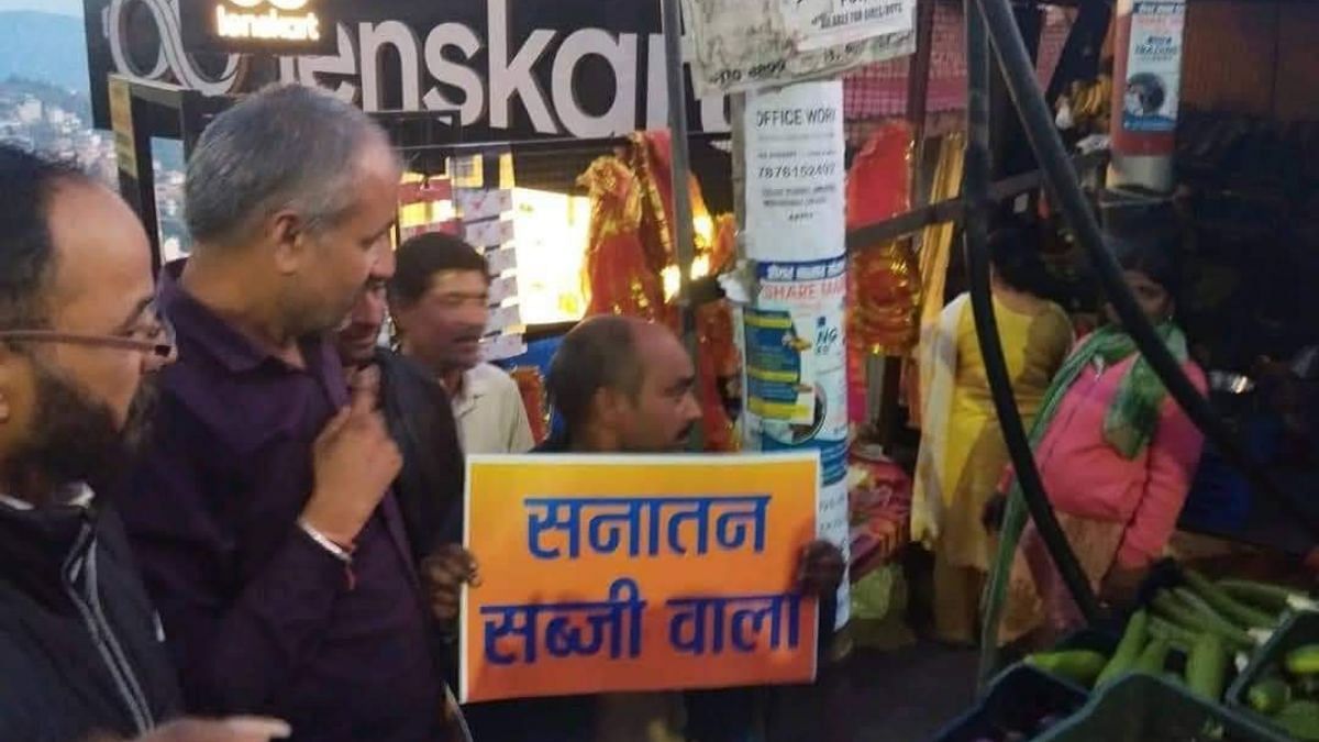 A vendor holds up the 'Sanatan Subziwala' sign in Sanjauli | Photo: Saurabh Chauhan, ThePrint