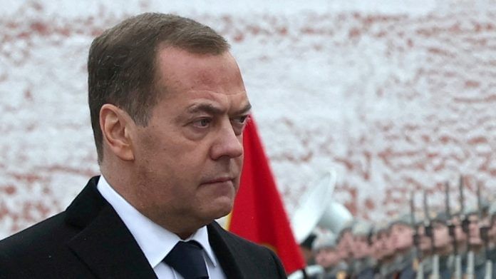 Russia's Deputy head of the Security Council Dmitry Medvedev takes part in a wreath laying ceremony marking Defender of the Fatherland Day at the Tomb of the Unknown Soldier by the Kremlin Wall in Moscow, Russia | Yekaterina Shtukina | Pool via REUTERS