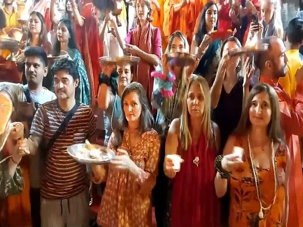 Foreign tourists perform aarti at Rishikesh's Parmarth Niketan on Diwali