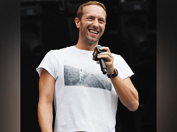 Chris Martin falls through stage trap door while performing with Coldplay in Australia