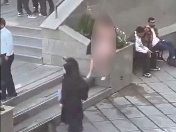 Iranian women detained after stripping to protest strict dress code at university