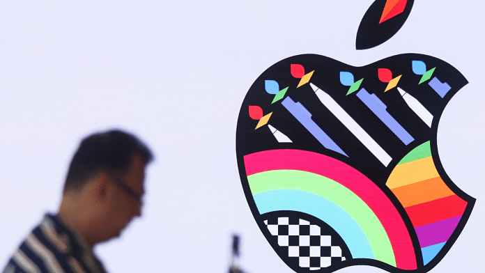A man takes a video inside India's first Apple retail store during a media preview, a day ahead of its launch in Mumbai, India, 17 April 2023. | Francis Mascarenhas | Reuters