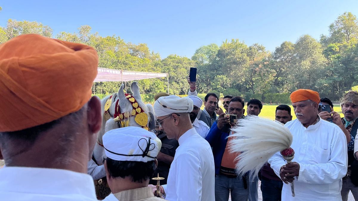 Vishvaraj Singh (centre) taking blessings from a white horse as part of the various rituals involved in the Maharana coronation. | Antara Baruah | ThePrint
