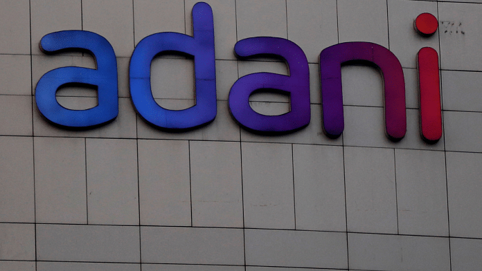 The logo of the Adani Group is seen on the facade of its Corporate House on the outskirts of Ahmedabad, India, 27 January 2023 | Amit Dave | Reuters