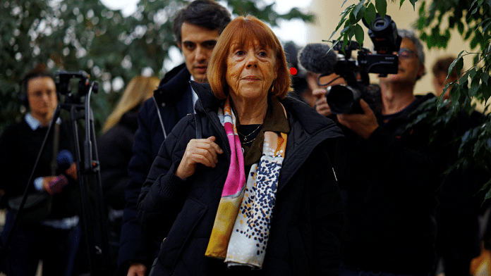 Frenchwoman Gisele Pelicot, the victim of an alleged mass rape orchestrated by her husband Dominique Pelicot at their home in the southern French town of Mazan, is surrounded by journalists as she arrives to attend the trial of Dominique Pelicot with 50 co-accused, at the courthouse in Avignon, France, 19 November 2024 | Sarah Meyssonnie | Reuters