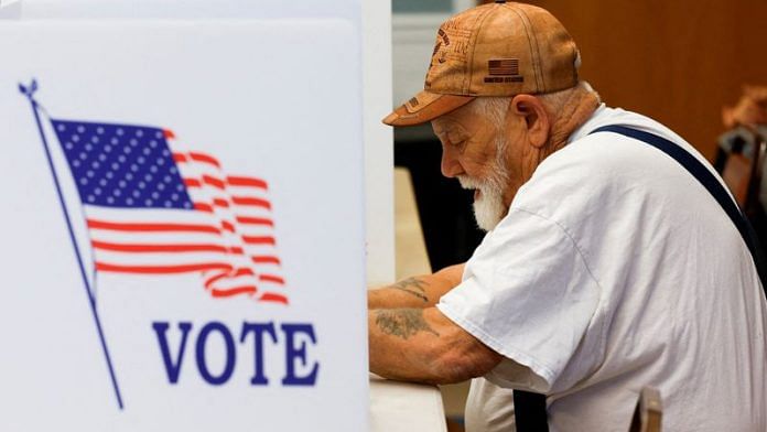 A man votes at St Andrew's church during the 2024 U.S. presidential election on Election Day in Erie, Pennsylvania, U.S., November 5, 2024. REUTERS/Shannon Stapleton/File Photo