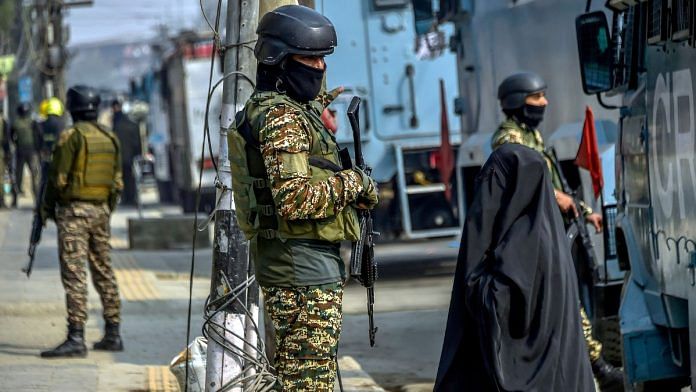 Security personnel stand guard following an encounter with terrorists in Khanyar area, in Srinagar on Saturday. (ANI Photo)