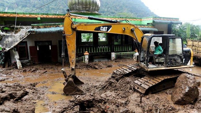 An excavator moves soil during the search and rescue of victims on the site of a landslide caused by heavy rain at Semangat Gunung Village in Karo, North Sumatra province, Indonesia, November 25, 2024. REUTERS/Stringer/File Photo
