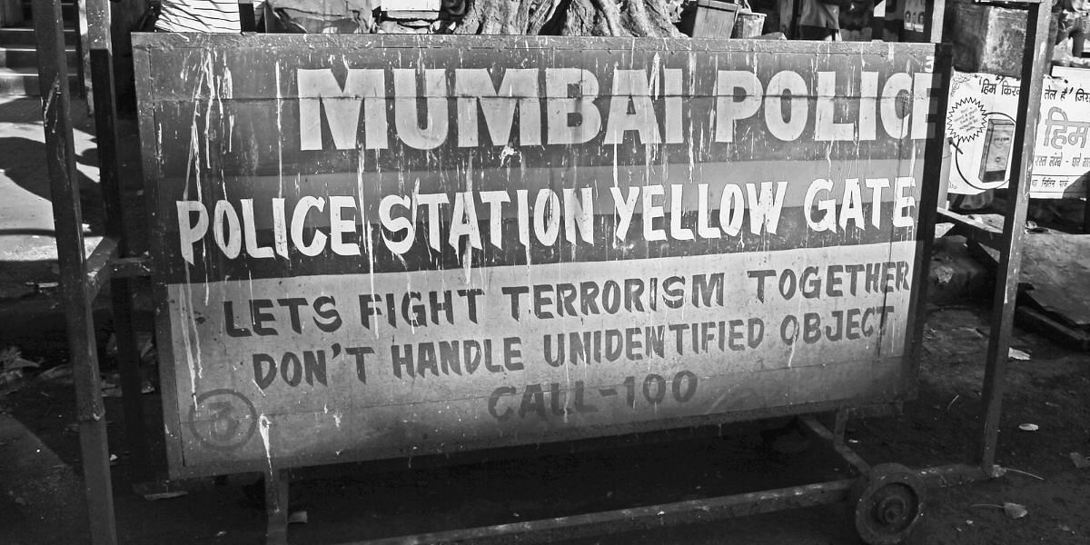 Nakabandi near Yellow Gate Police Station, where the police barricade shows security messaging after the 26/11 attacks.