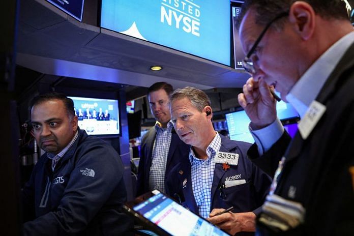 Stocks fall with dollar as investors assess data, Trump tariff pledge