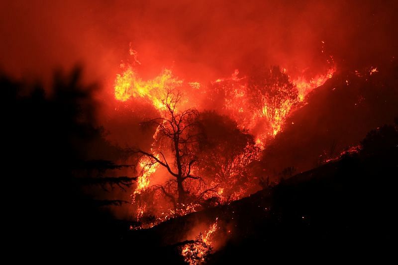 Thousands under evacuation orders in California as wildfires destroy