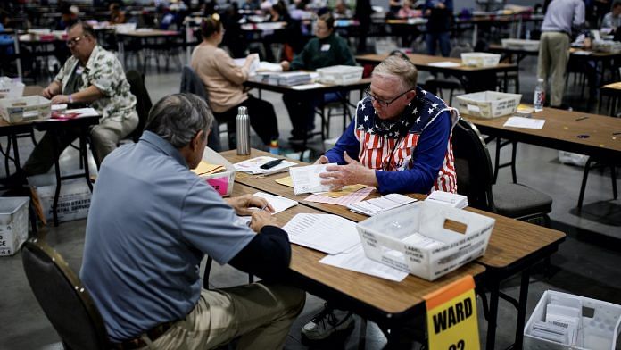 Electoral workers count votes during the 2024 U.S. presidential election, in Milwaukee, Wisconsin | Eduardo Munoz | Reuters