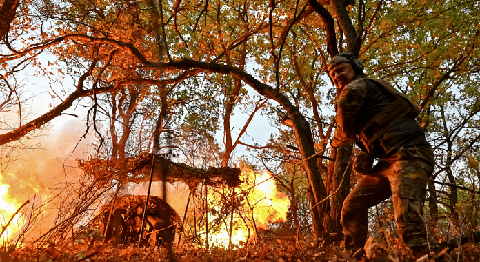 A Ukrainian service member from the special police unit Hyzhak (Predator) fires a howitzer D30 towards Russian troops, amid Russia's attack on Ukraine, near the frontline city of Toretsk, Ukraine | Stringer | Reuters
