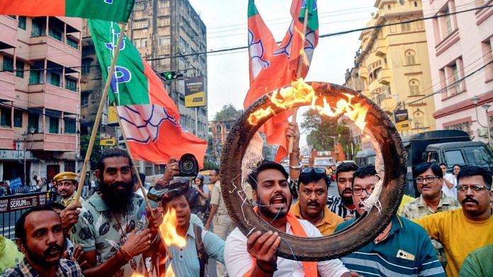 BJP workers protest after the Beldanga clashes | ANI