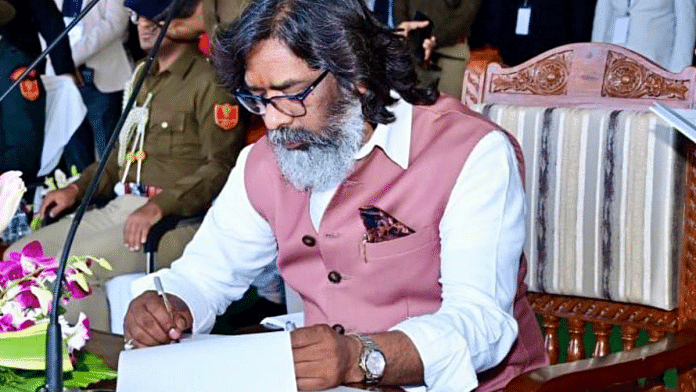 JMM executive president Hemant Soren signs after taking oath as the 14th Chief Minister of Jharkhand, in Ranchi | ANI