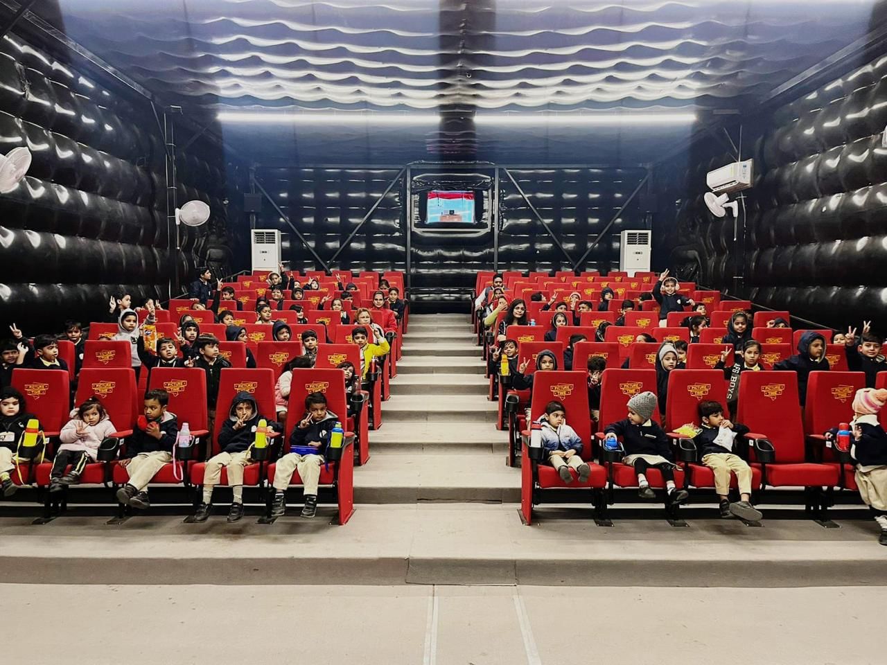 A screening for school children at Picture Time's inflatable theatre, Nagaur
