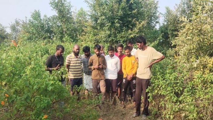 A group of villagers gathered at the spot where Ram Ratan Yadav was found dead, in Deora Saturday | By special arrangement