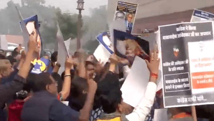 MPs of INDIA bloc and BJP come face-to-face at the Parliament while carrying out their respective protests over Dr BR Ambedkar. | Screen grab | X\@ANI