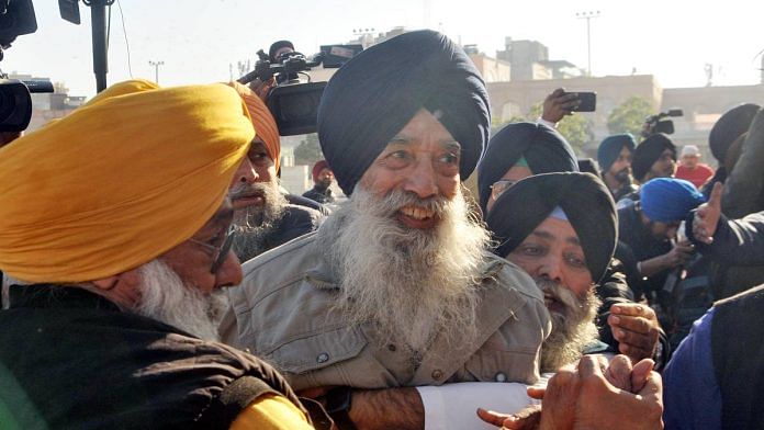 Narain Singh Chaura being taken into custody after he tried to fire at Sukhbir Singh Badal at the Golden Temple in Amritsar Wednesday | Photo: ANI