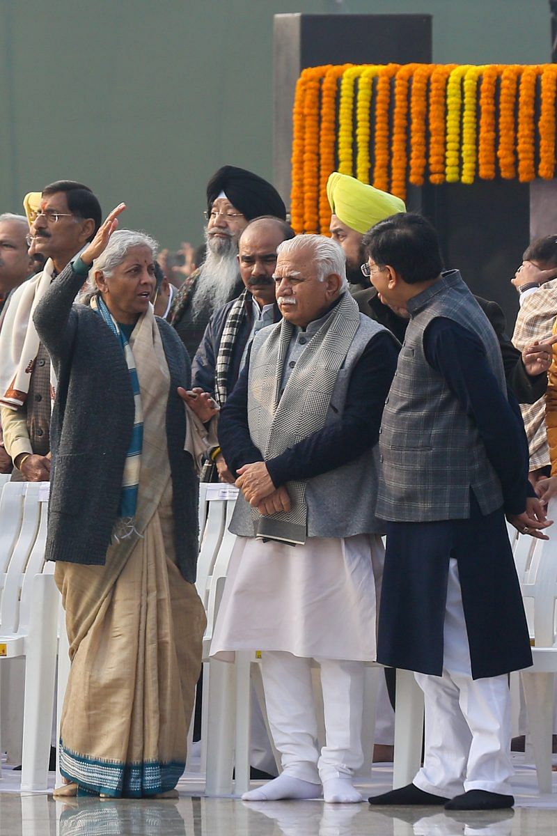 Finance Minister Nirmala Sitharaman speaks to Manohar Lal Khattar & Piyush Goyal at the ceremony | Photo: Suraj Singh Bisht | ThePrint