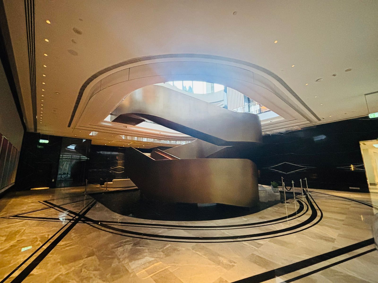 The winding staircase inside the clubhouse, leading to gym and salon | Vandana Menon, ThePrint