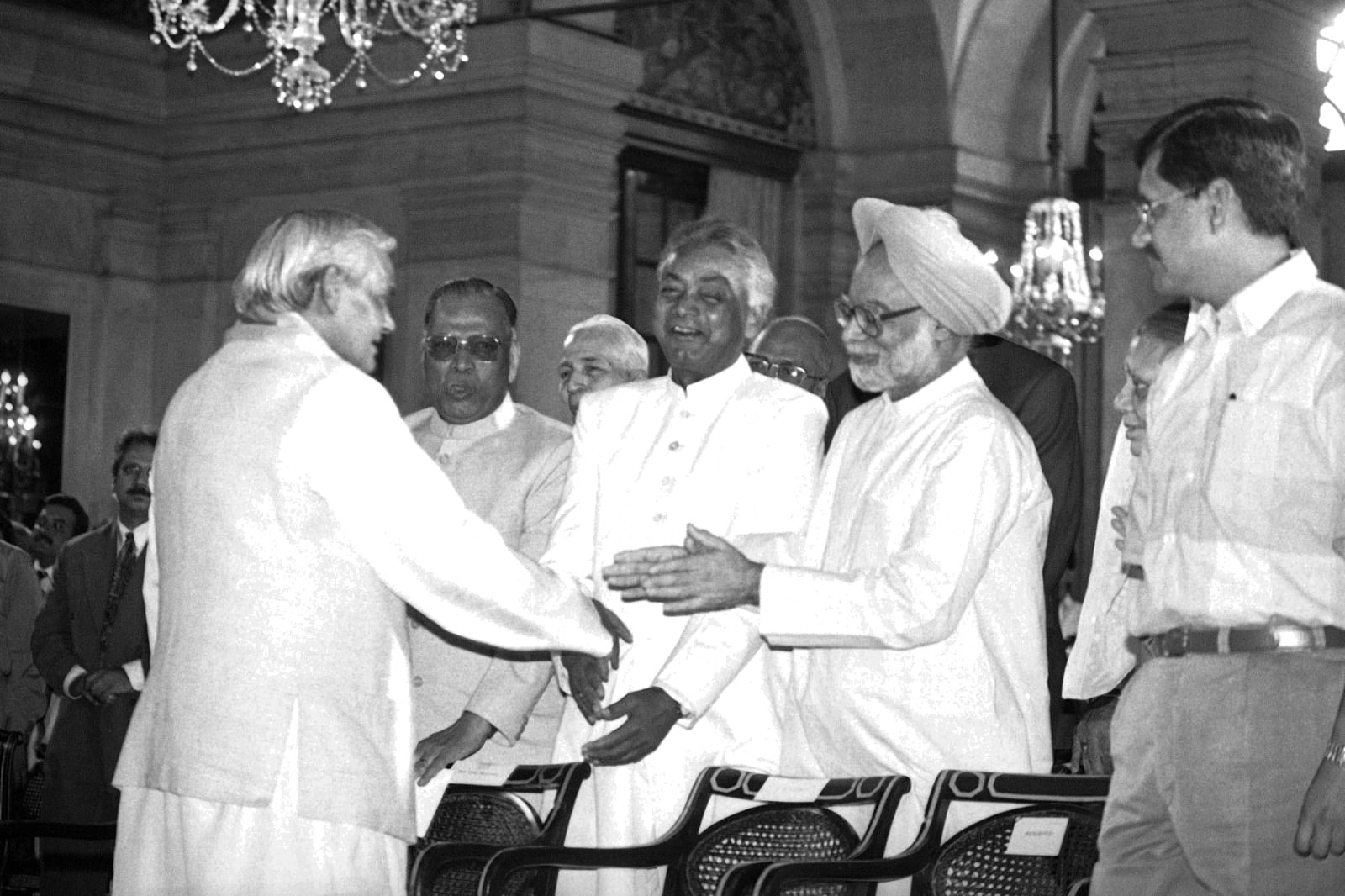 Manmohan Singh Congratulates Atal Bihari Vajpayee at Rashtrapati Bhawan | Photo: Praveen Jain