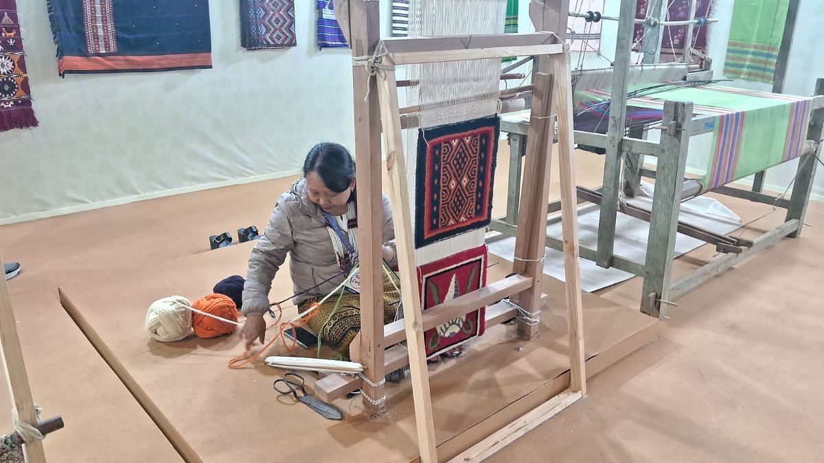 Tashi Choju from Arunachal Pradesh weaving a traditional Arunachali carpet | Photo: Sonika Kumar, ThePrint
