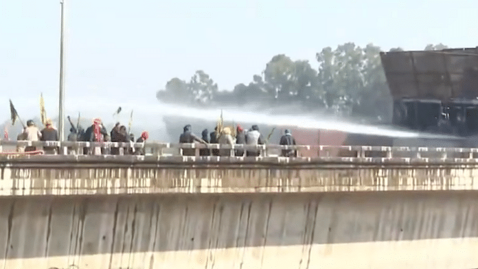 Police use water cannons to disperse protesting farmers at ShambhuBorder. | Screen grab | PTI