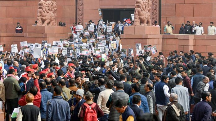 MPs from the BJP & INDIA bloc protesting against each other in the Parliament complex last week | ANI