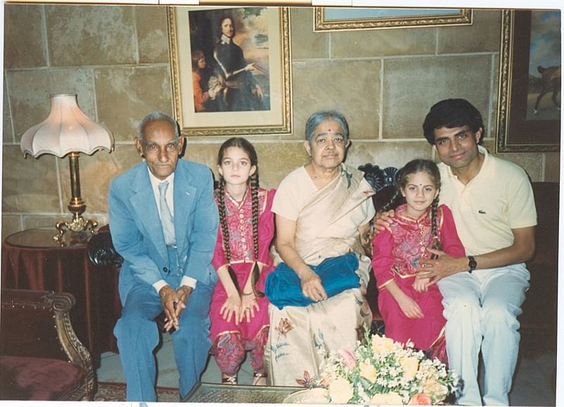 Professor SK Chatterjee and professor Rajeswari Chatterjee with a former student's family, 1980