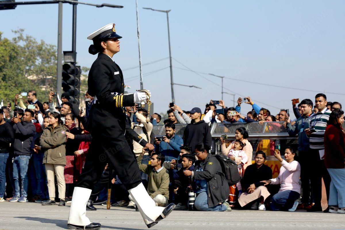 An officer from the Indian Navy contingent marches on Kartavya Path as a crowd looks on. | Photo: Suraj Singh Bisht | ThePrint