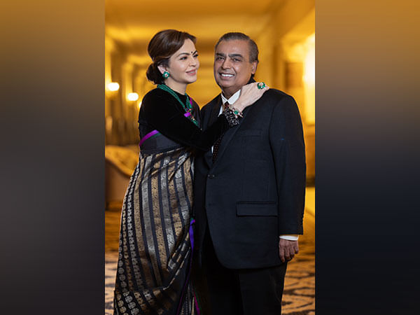 Nita, Mukesh Ambani pose for pictures at President-elect Trump's reception Nita, Mukesh Ambani pose for pictures at President-elect Trump's reception