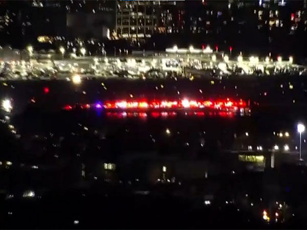 At least 2 bodies found after American Airlines plane with 64 on board crashes near Reagan National Airport DC